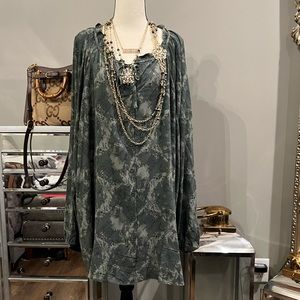 This top is army green, and has designs on it for Doctor Who. Key hole on chest